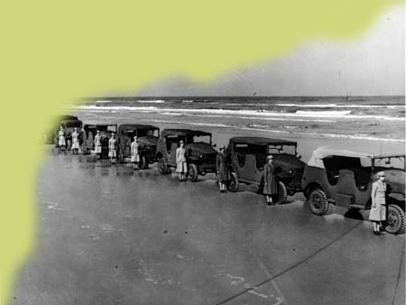 Personnel of the Women's Army Corps lined up with vehicles for inspection at Daytona Beach