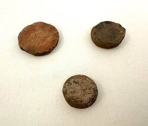 Gaming discs, ca. 1450–1700 Artifacts courtesy the Bureau of Archaeological Research