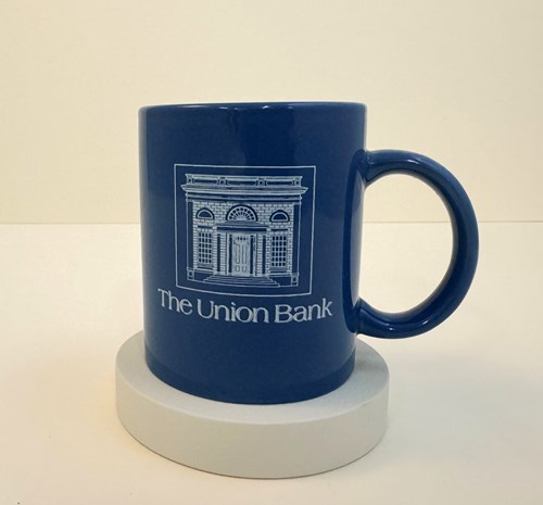 This mug was provided by Barbara Stevens Heusel and Dennis Moore in celebration of the new Union Bank Museum exhibition and opening. It was originally purchased at the Museum’s gift shop in the 1980s.