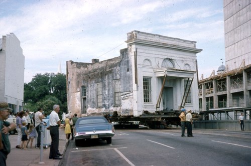 Spectators look on as the Union Bank Building is moved from its original location on Adams Street to the Apalachee Parkway, October 1971.   Image courtesy of the State Archives of Florida.