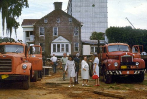 Color image of people on the site of The Columns shortly before it is moved to its current location, 1971. Courtesy of the State Archives of Florida.