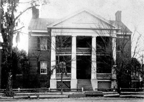 The Columns, built around 1830, is shown here at its original location on the southwest corner of Adams Street and Park Avenue. Courtesy of the State Archives of Florida.